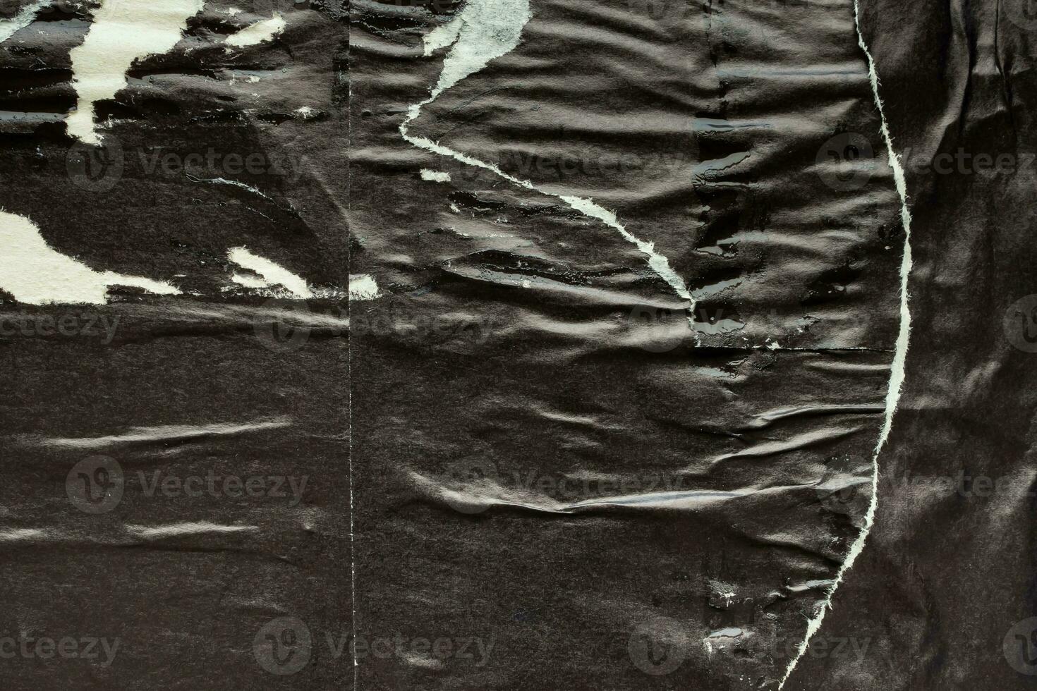 Old grunge ripped torn black paper poster surface texture background photo