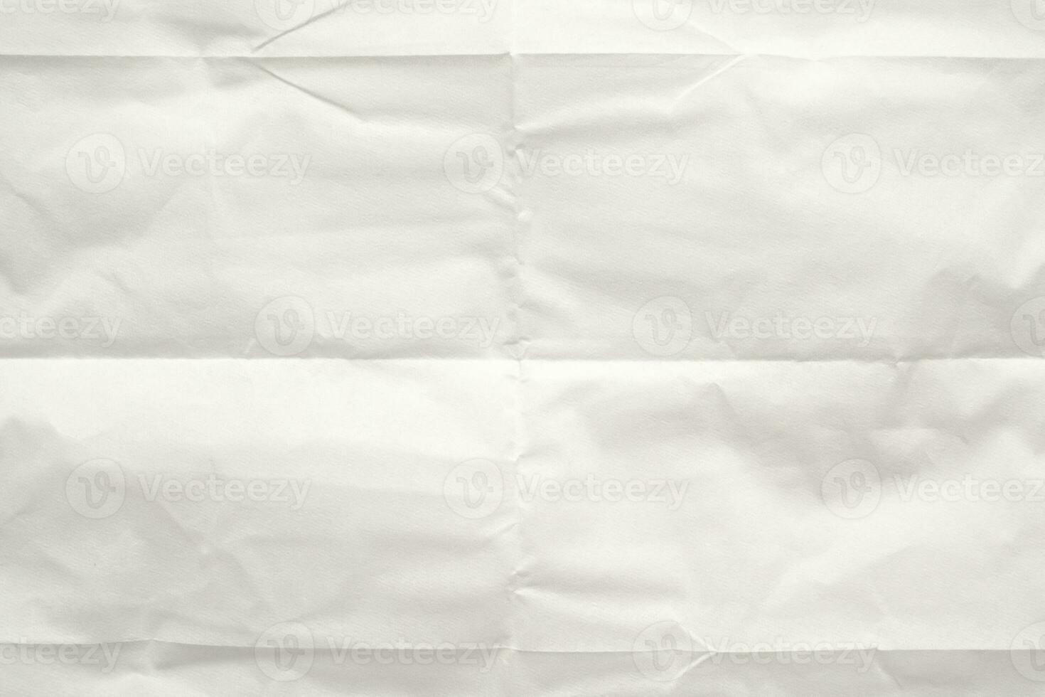 White folded and wrinkled paper texture background photo