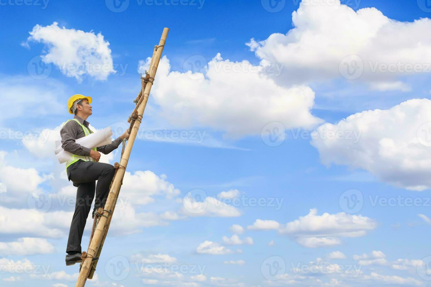 Asian business man engineer climbing up ladder with blue sky, career growth and success concept photo