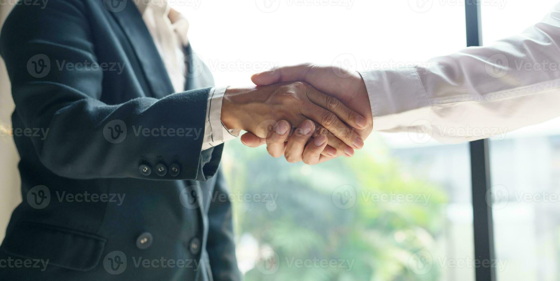 Businessman shaking hands successful making a deal. mans handshake. Business partnership meeting concept photo