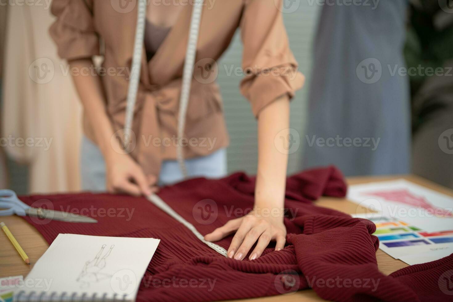 Stylish Fashion Designer work as sketch of new collection in atelier. Creative Design Concept photo