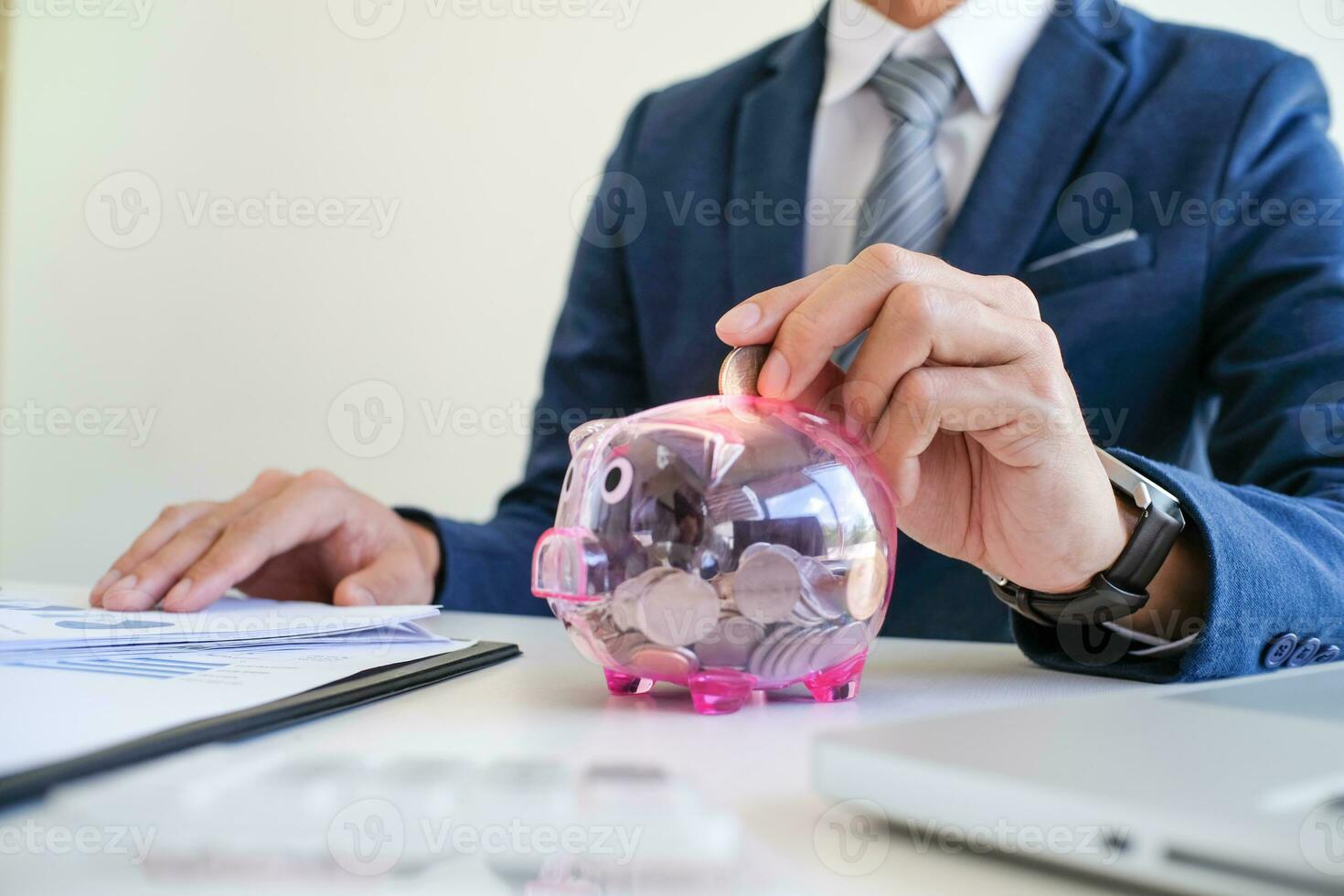 Saving money. Businessman Accountant verify growing business and saving money stacking coins with calculator. Accountancy Concept. photo