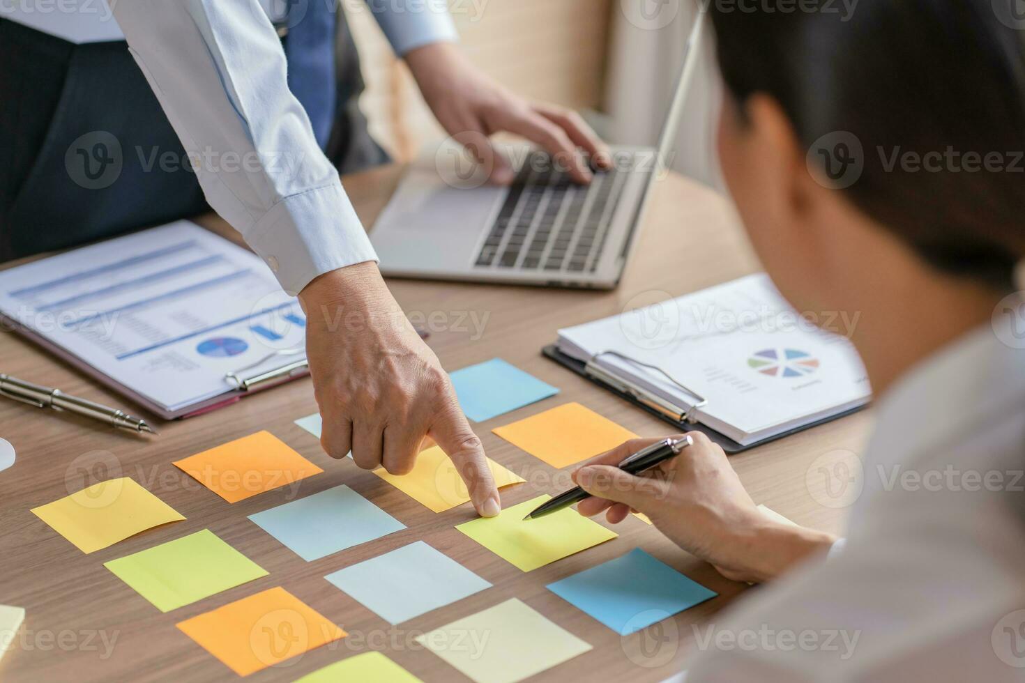 Business People brainstorming Meeting Design Ideas use post it notes to share idea professional investor start up project business brainstorming planning in office photo