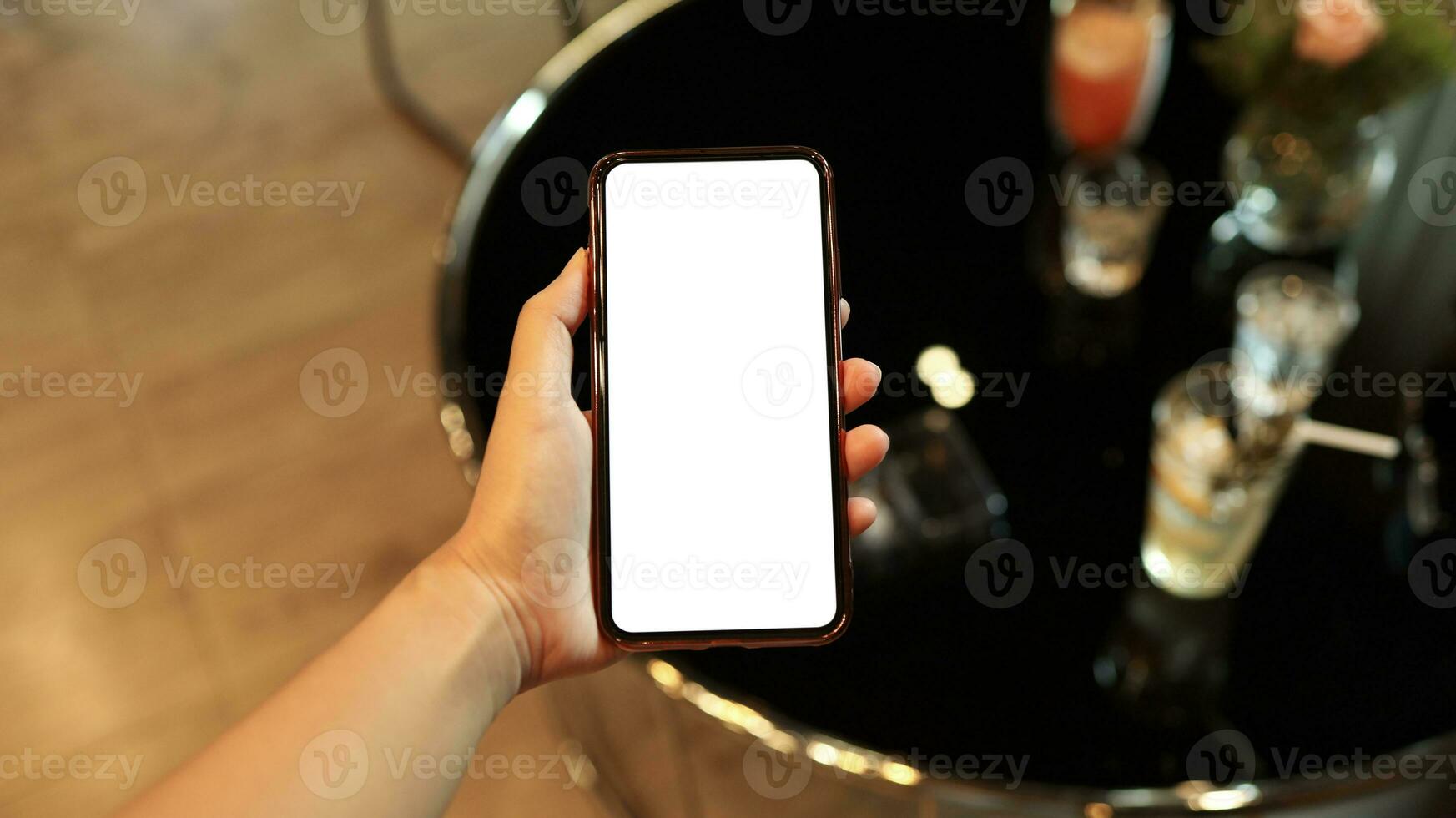 Women's hands holding cell telephone blank copy space screen. smartphone with blank white screen isolated on white background . smart phone with technology concept photo