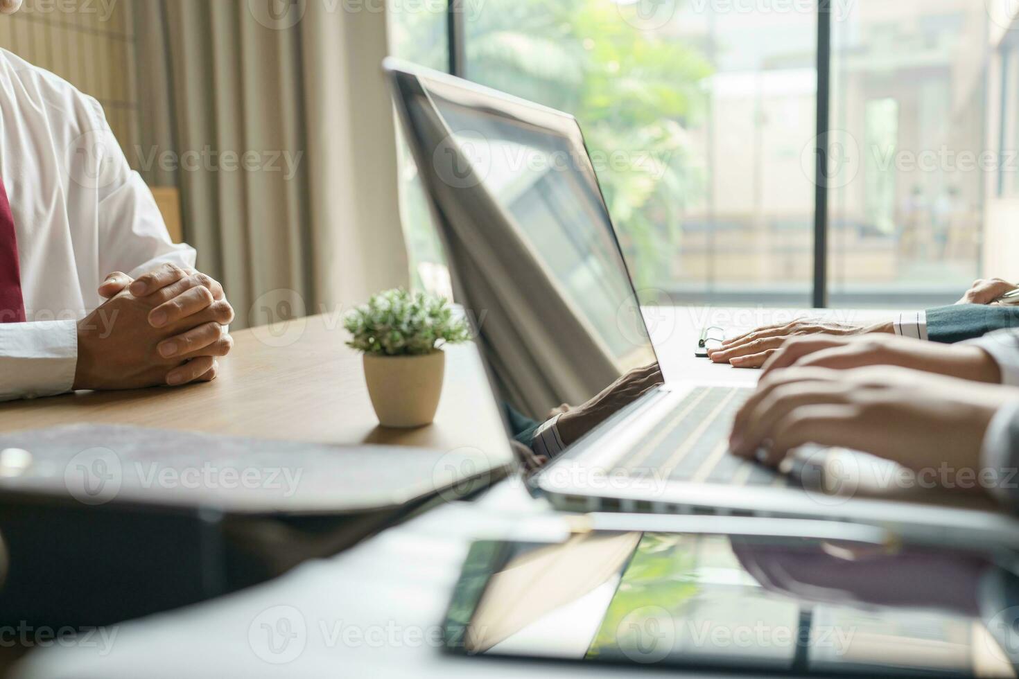 Examiner reading a resume during job interview at office Business and human resources concept photo