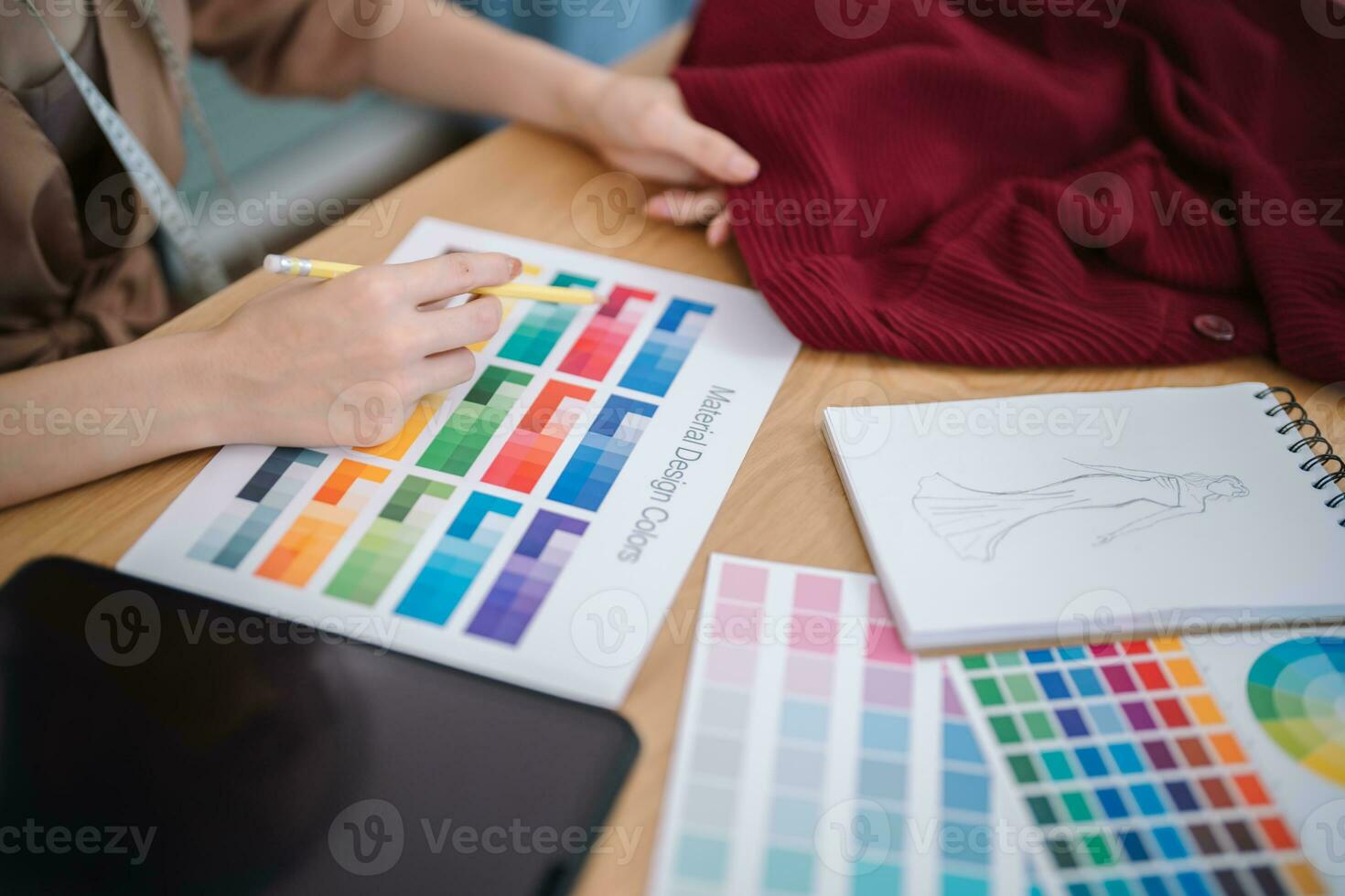 Stylish Fashion Designer work as sketch of new collection in atelier. Creative Design Concept photo