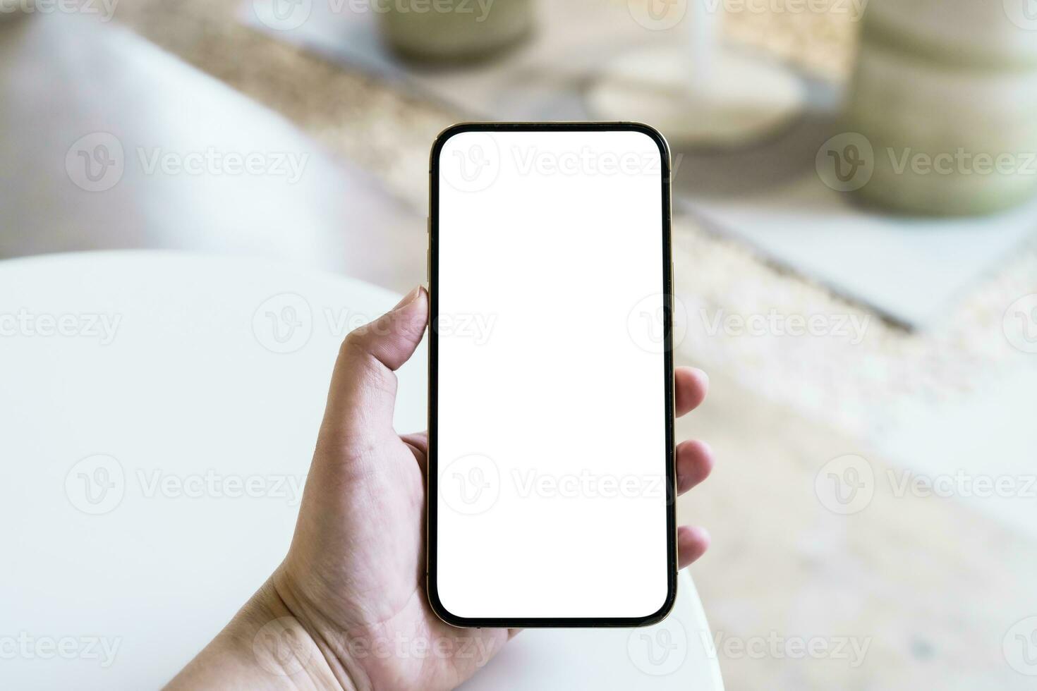 Women's hands holding cell telephone blank copy space screen. smartphone with blank white screen isolated. smart phone with technology concept. photo