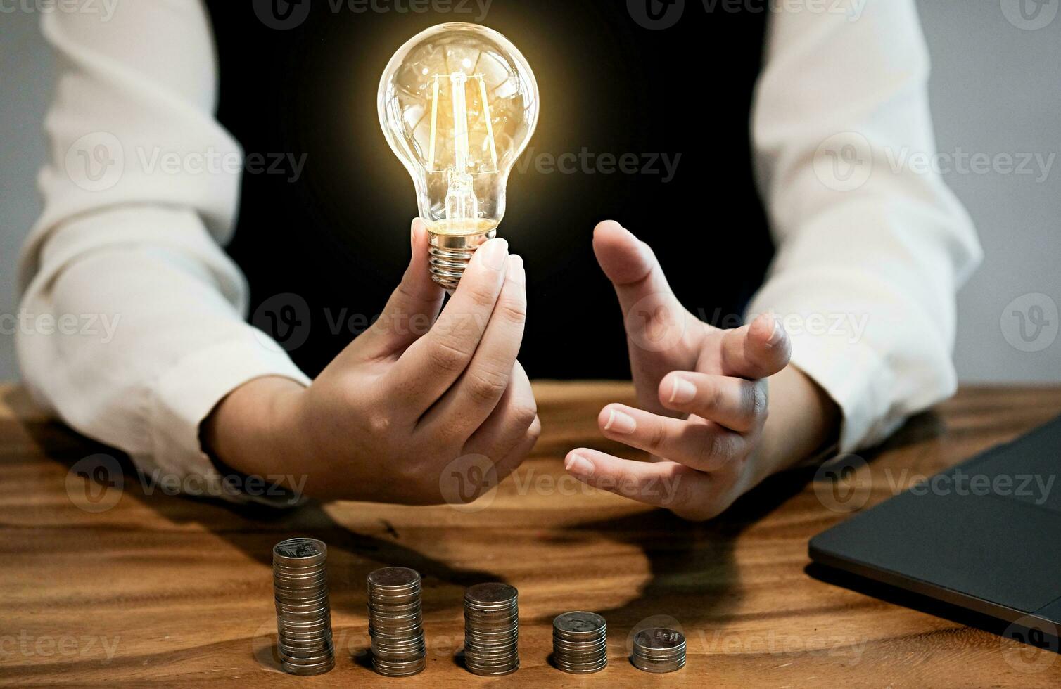 saving coins idea with light bulb for investment Concept idea and innovation. photo