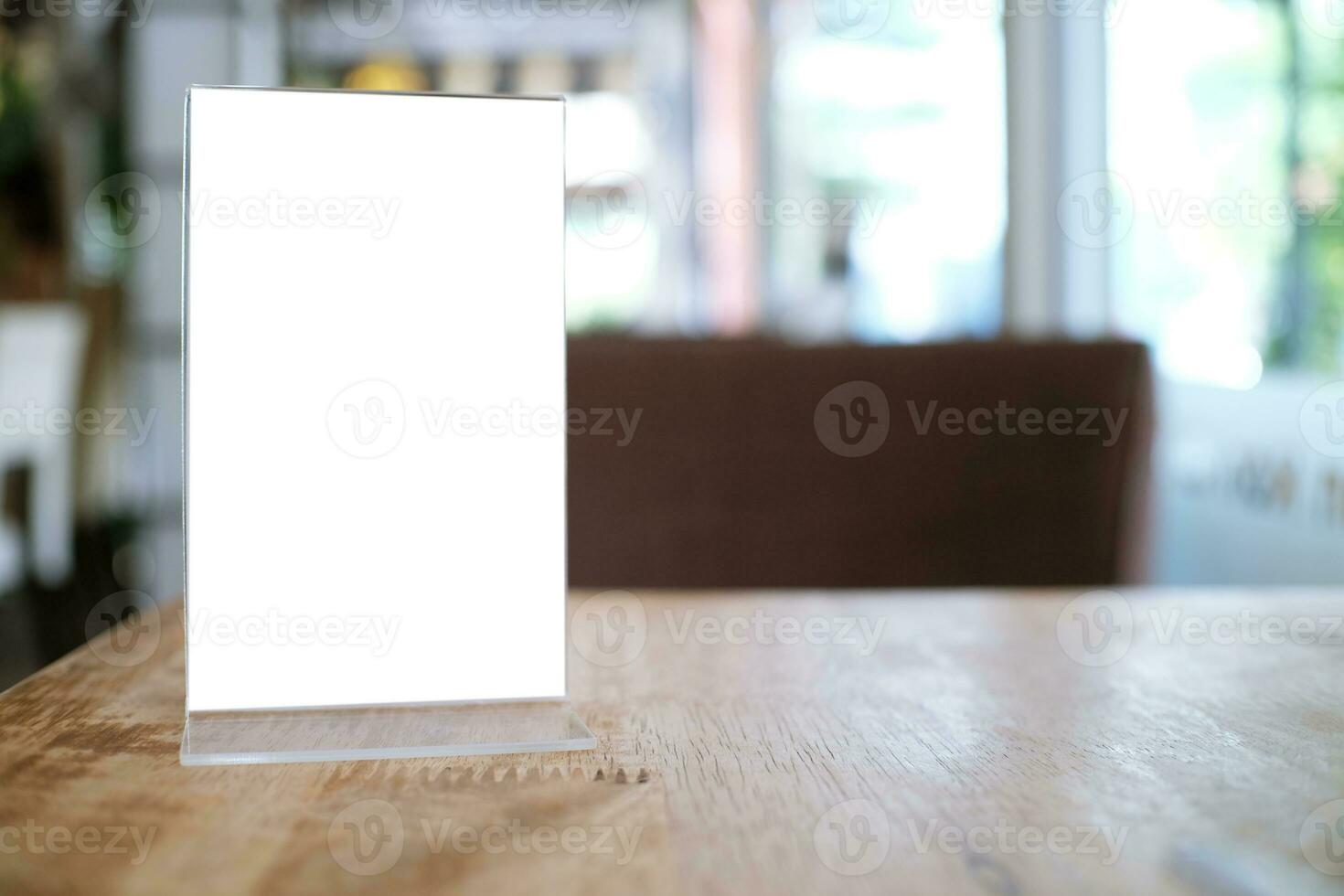 Menu frame standing on wood table in Bar restaurant cafe. space for text marketing promotion. photo