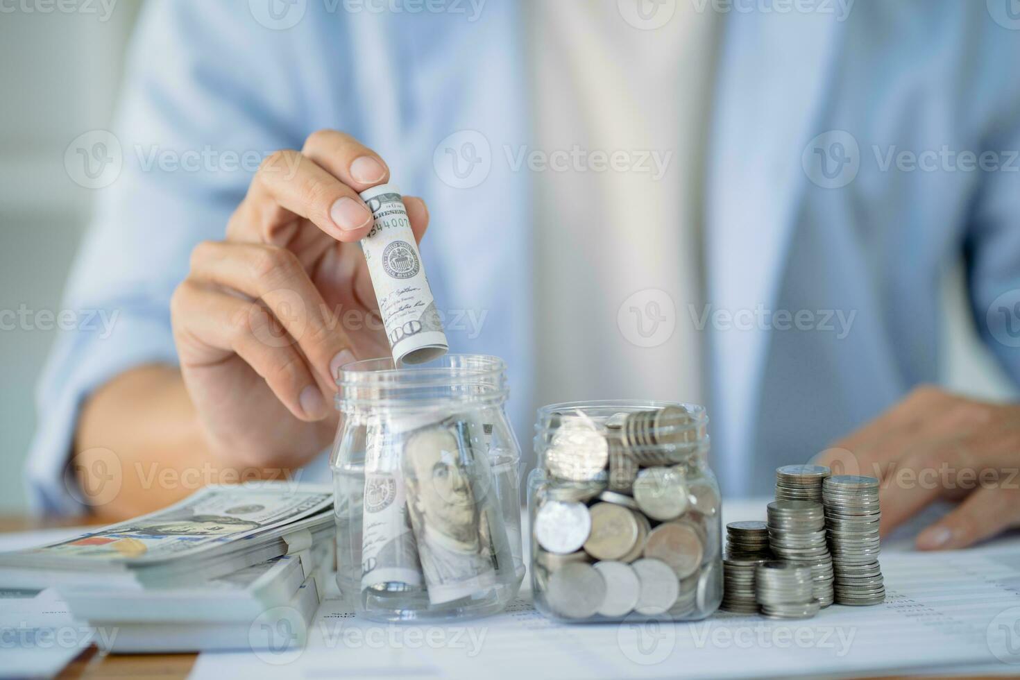 Saving money. Businessman Accountant verify growing business and saving money stacking coins with calculator. Accountancy Concept. photo