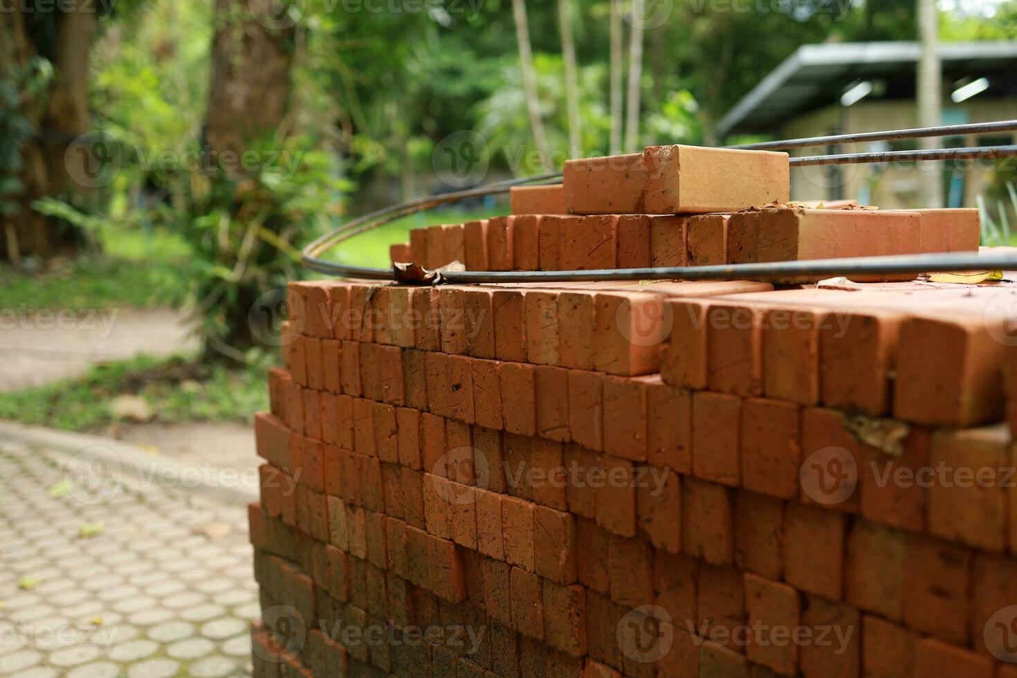 Pallet a red brick building material stack of new red bricks for construction. photo