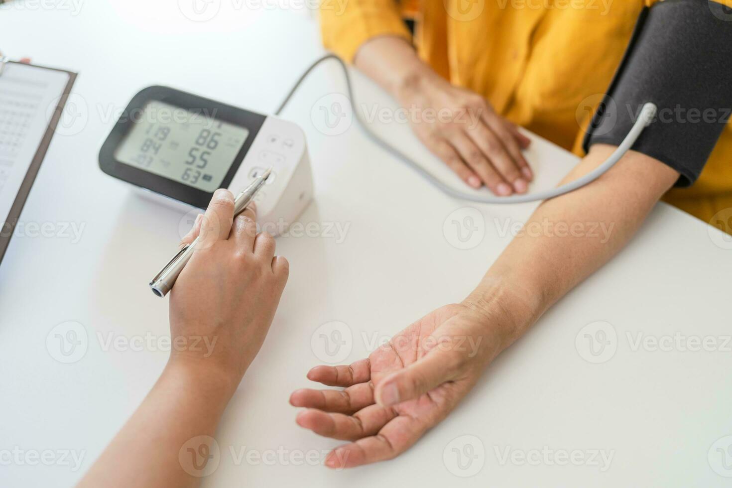 Doctor checking  patient arterial blood pressure. Health care. photo