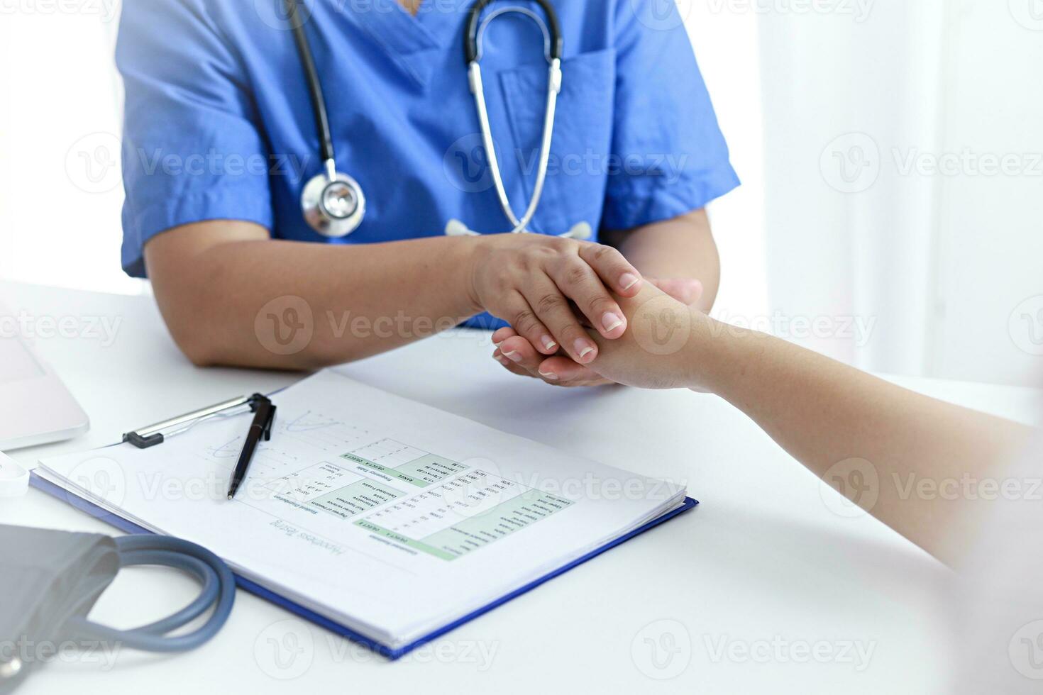 Doctor holding patient's hand, and reassuring woman patient helping hand concept. photo