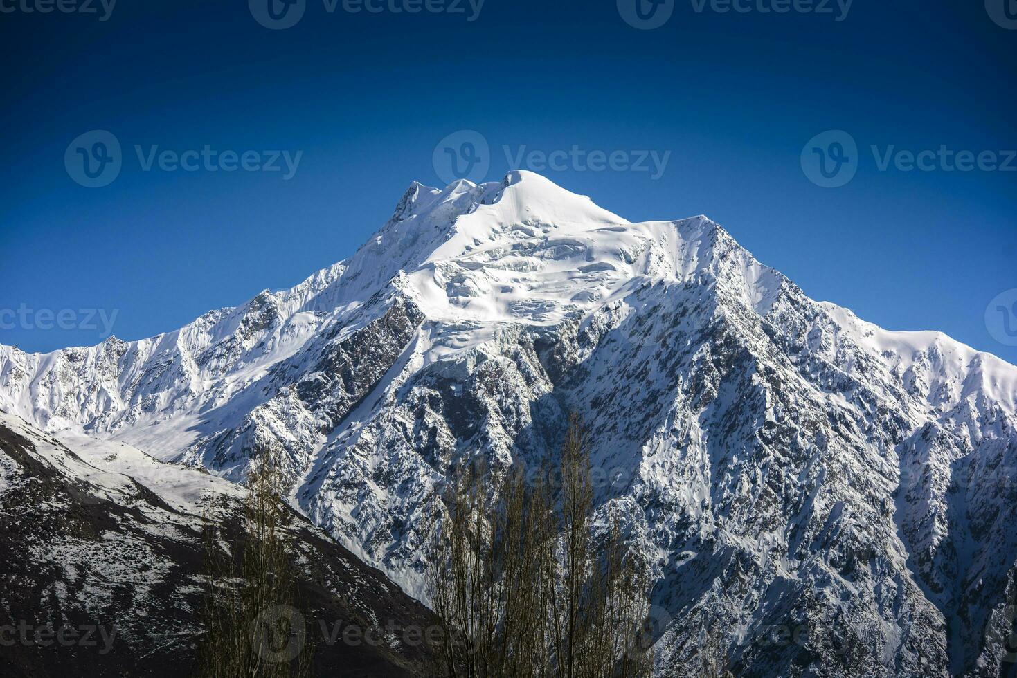 Beautiful snow mountain with Blue Sky from pakistan. photo