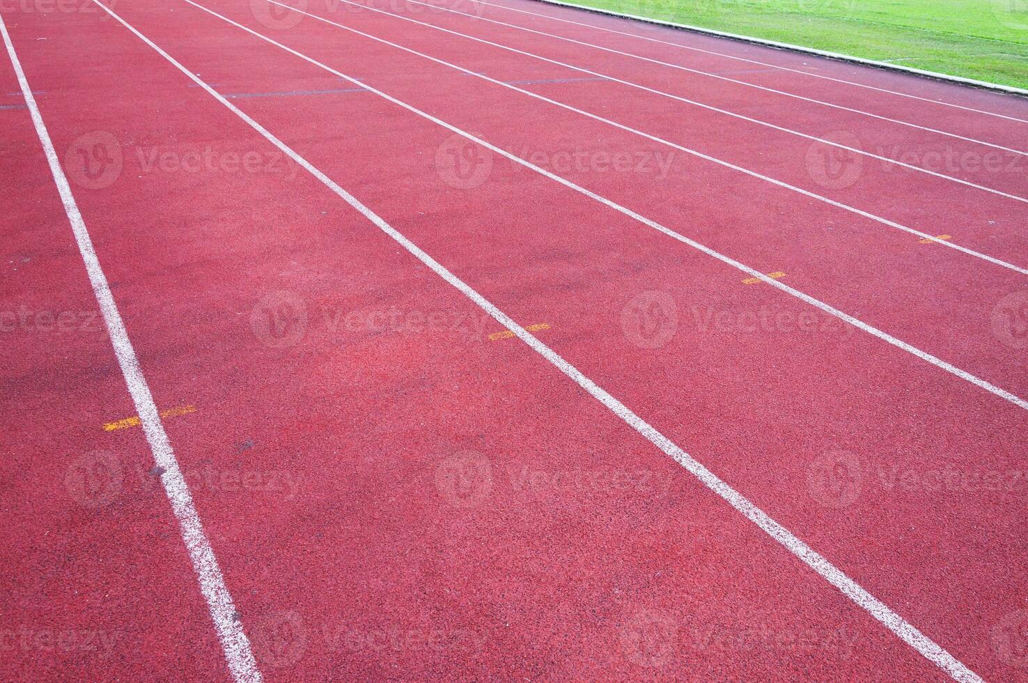 running track and green grass,Direct athletics Running track at Sport Stadium photo