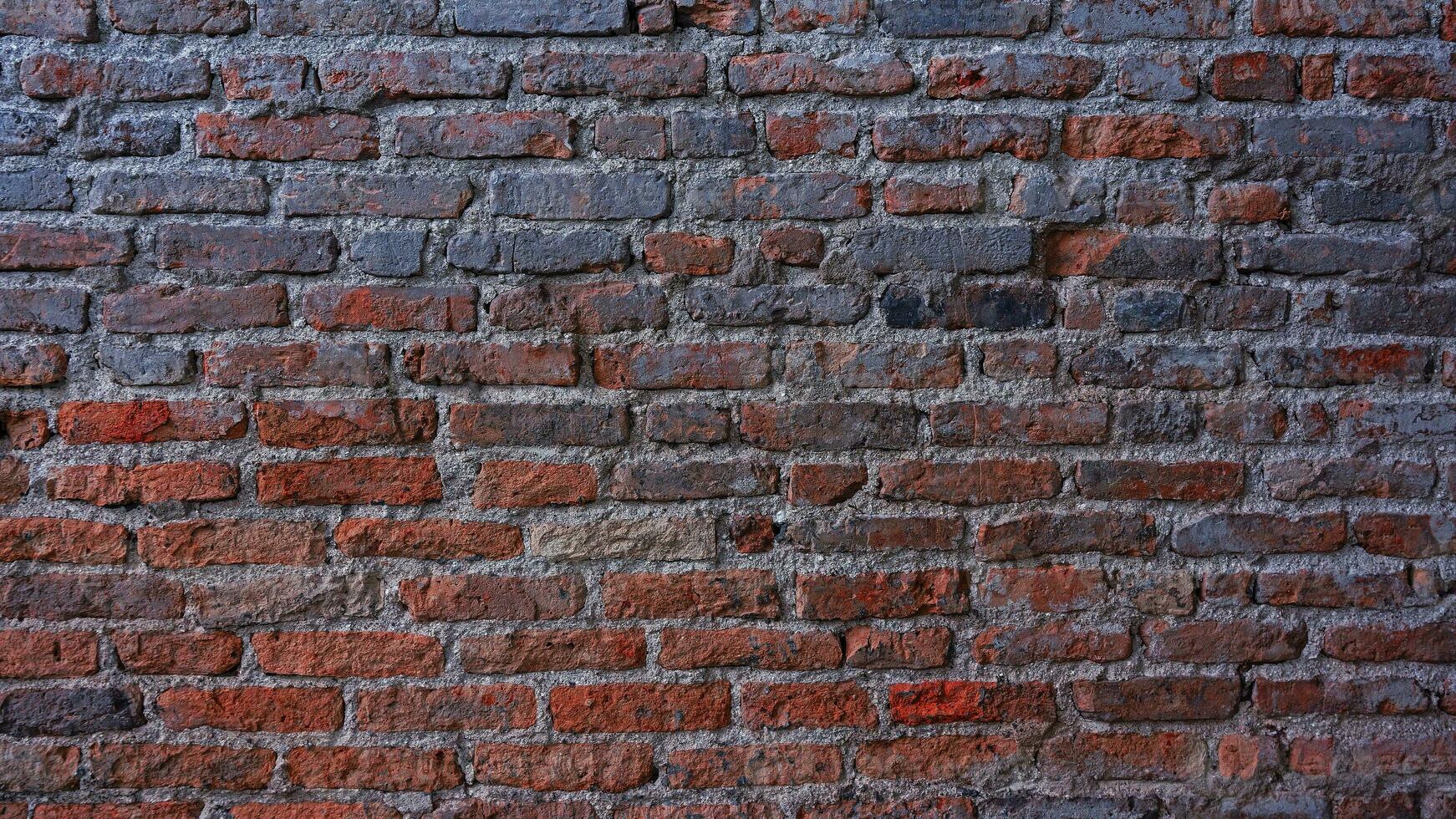 Old vintage brick wall, Decorative dark brick wall surface for background photo