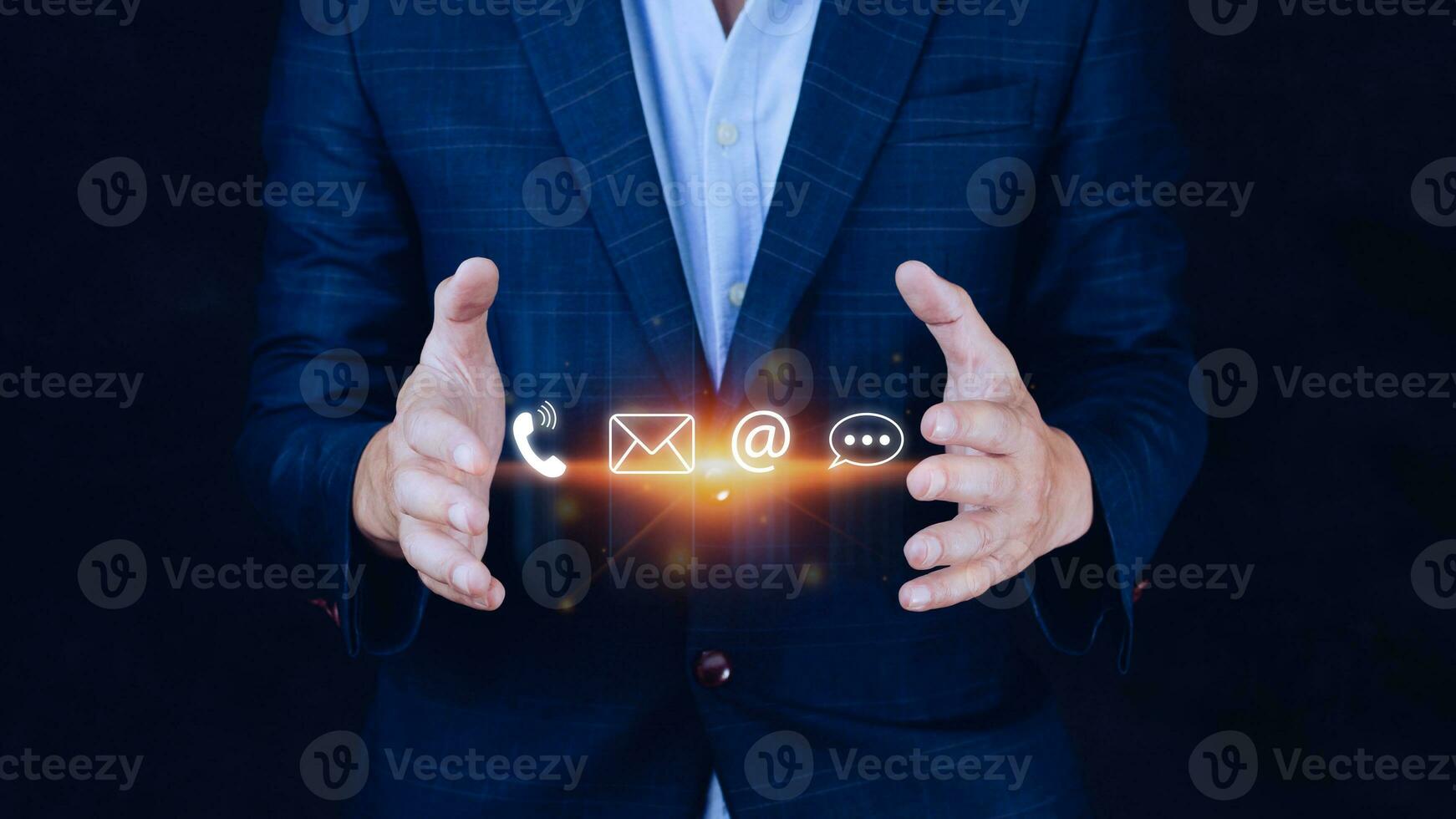 Contact us or Customer support hotline people connect. Businessman using showing and touching on virtual screen contact icons call phone, email, address, live chat, photo