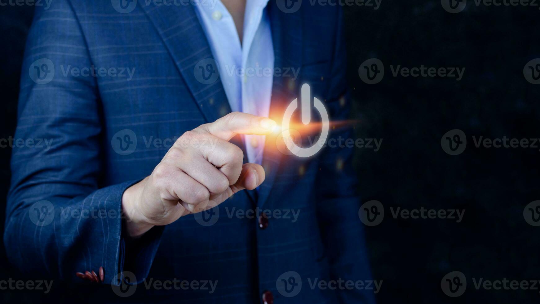 Businessman pushing visual touch screen power button with his finger,network structure,Hand pressing power button photo