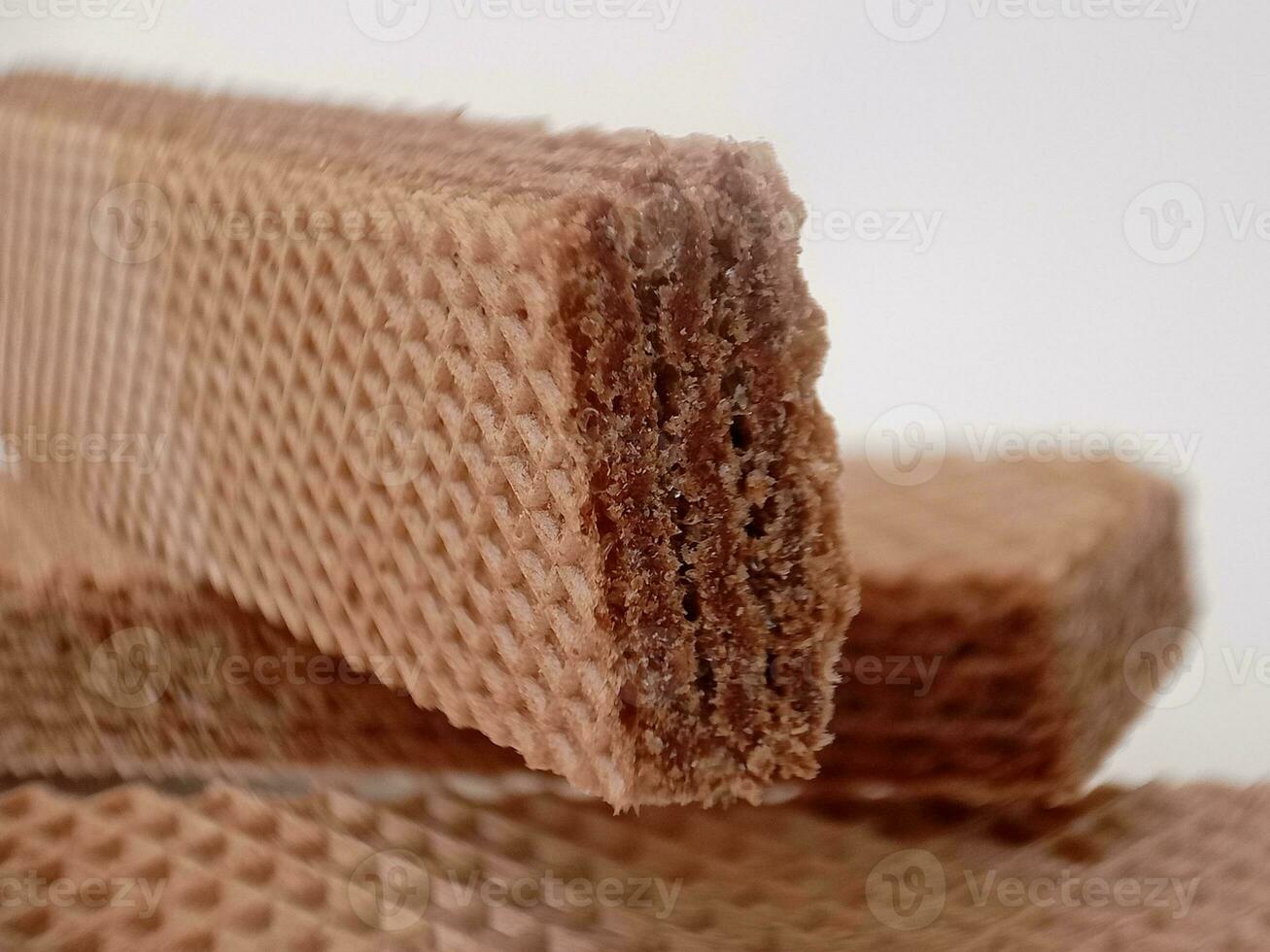 Delicious chocolate wafers on white background photo