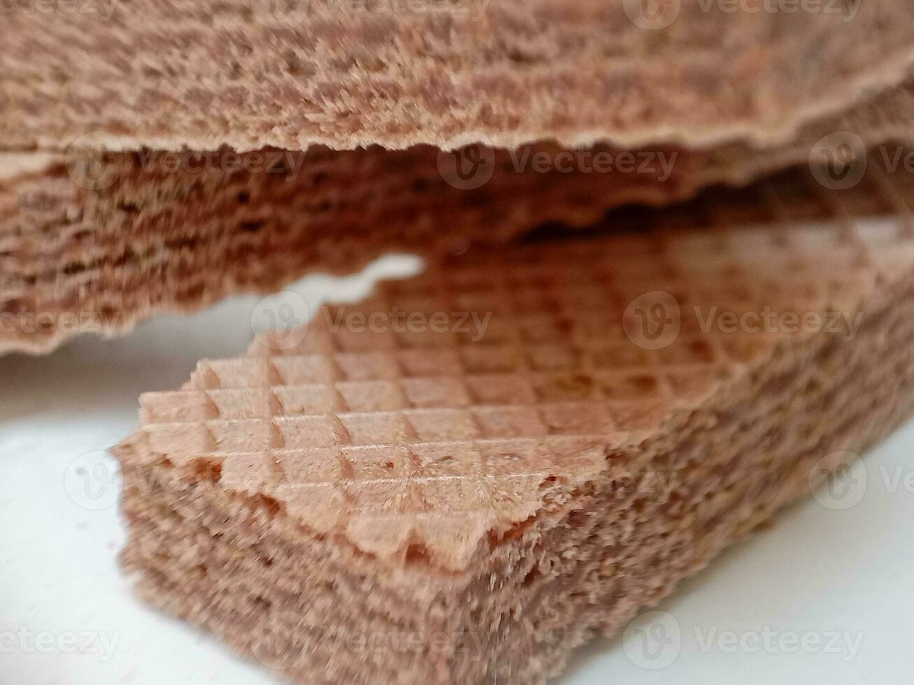 Delicious chocolate wafers on white background photo