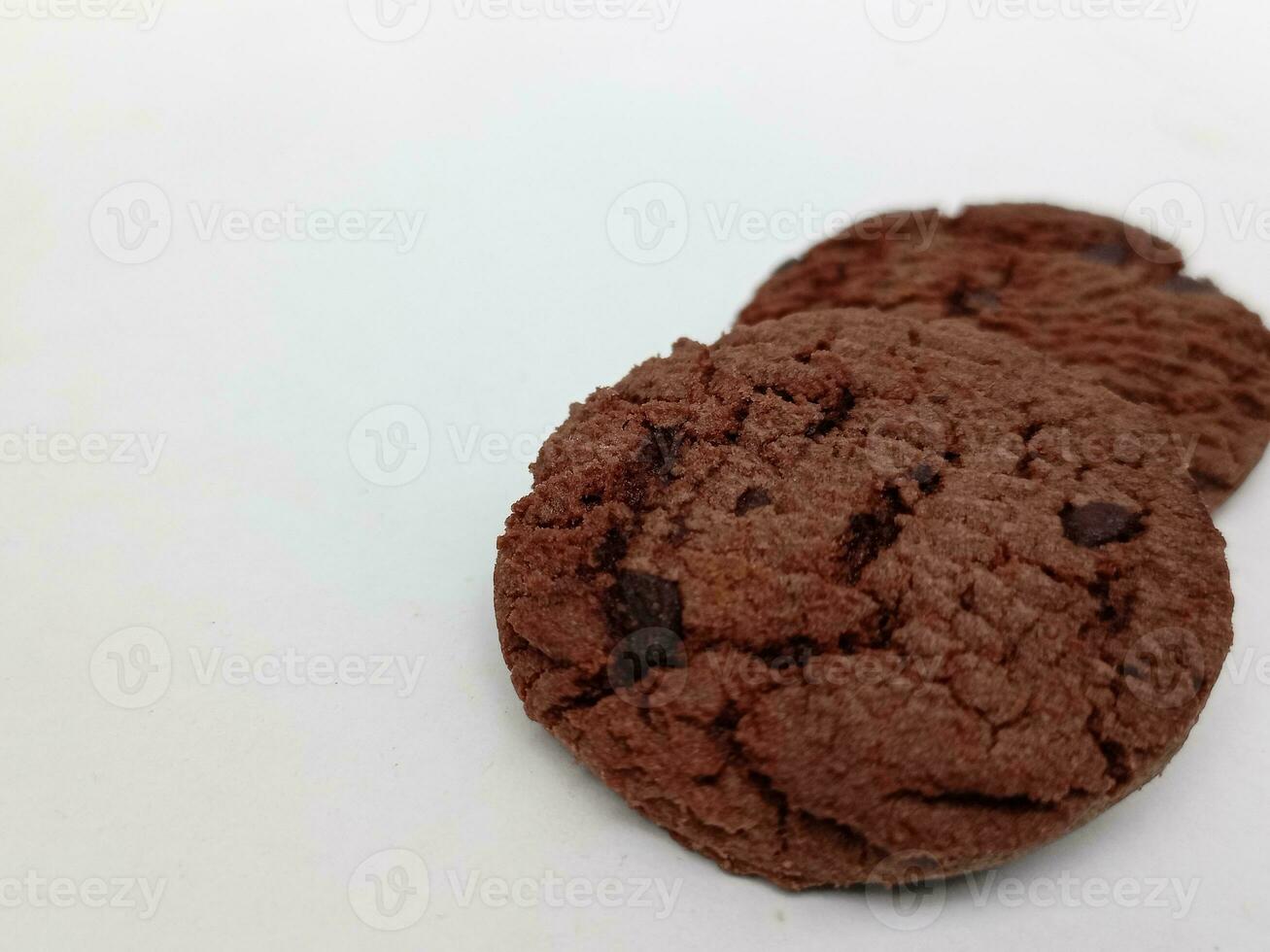 Chocolate chip cookies with hazelnuts, isolated on white background photo