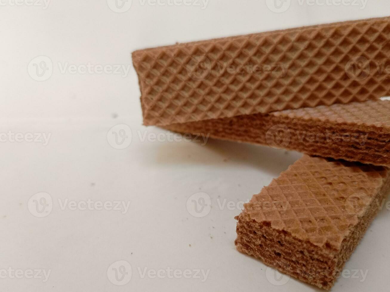 Delicious chocolate wafers on white background photo