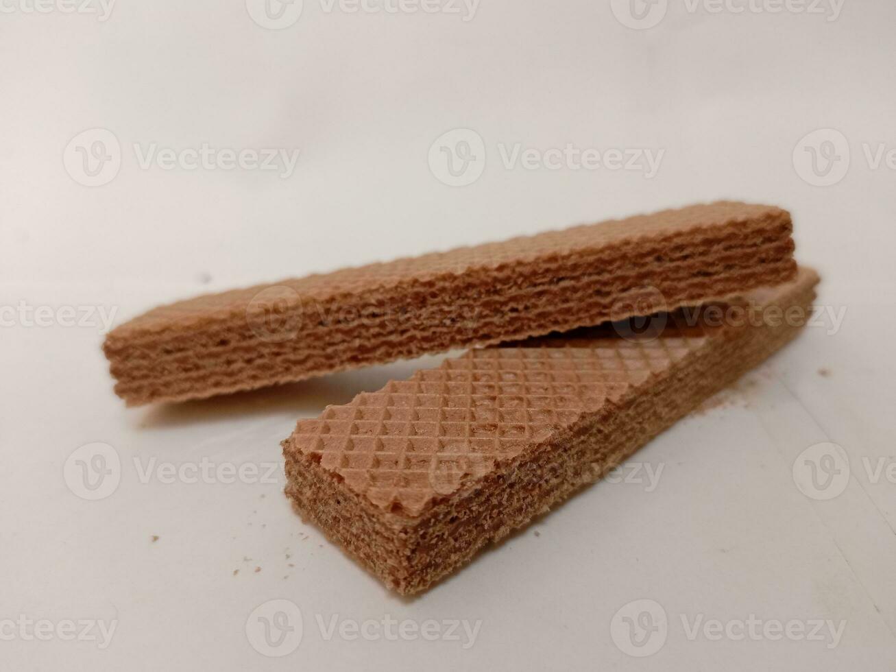 Delicious chocolate wafers on white background photo