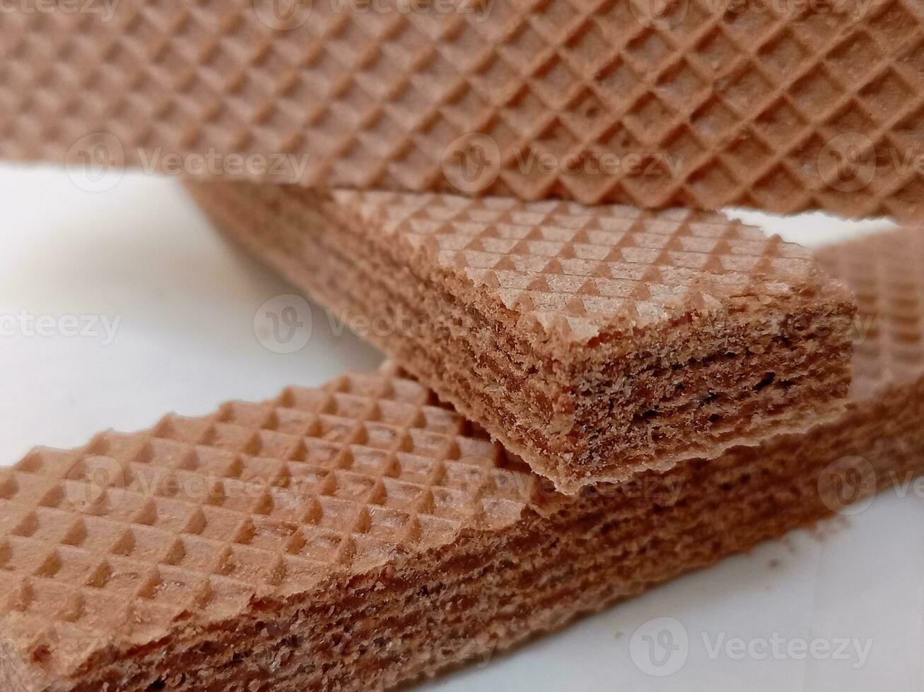 Delicious chocolate wafers on white background photo