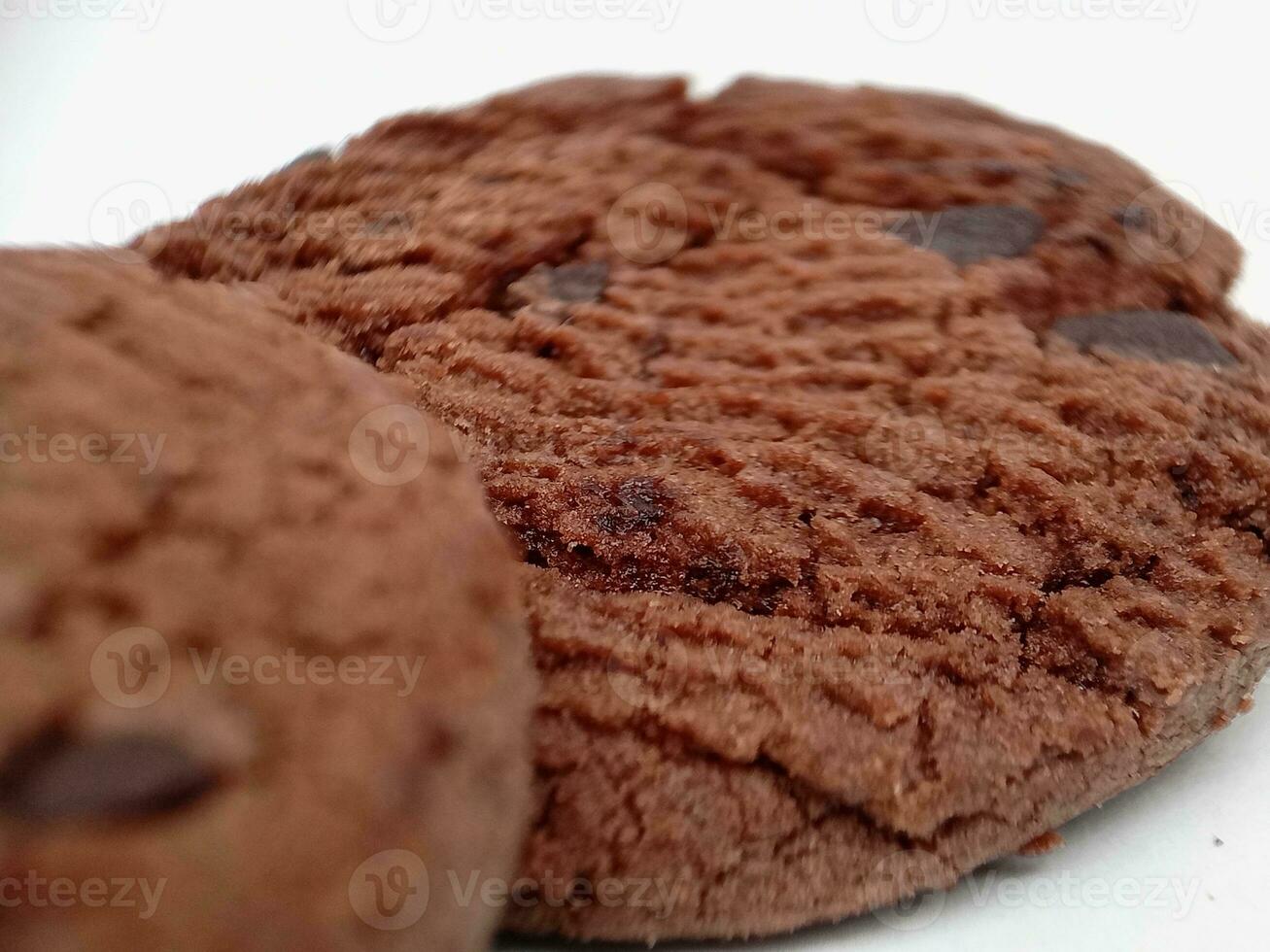 Chocolate chip cookies with hazelnuts, isolated on white background photo