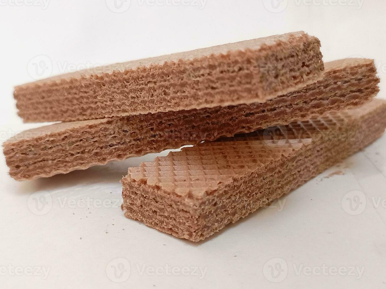 Delicious chocolate wafers on white background photo