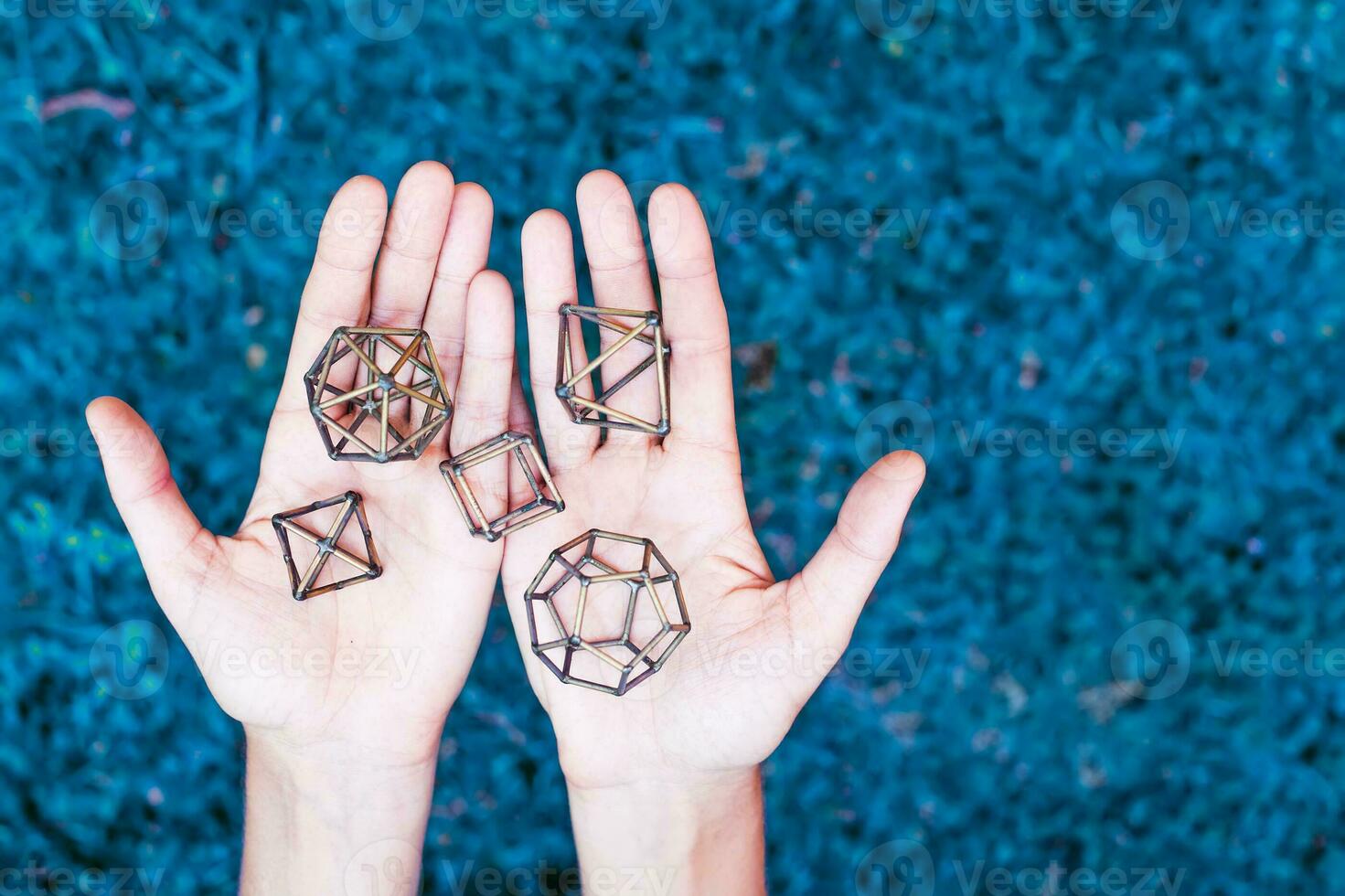 Hands holding sacred geometry photo