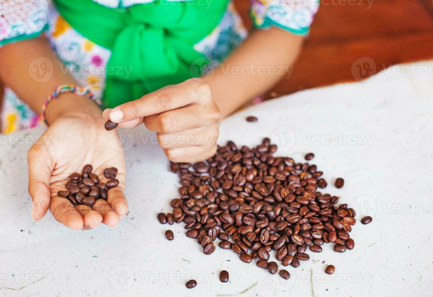 Closeup photo of woman choosing the coffee beans of the best quality