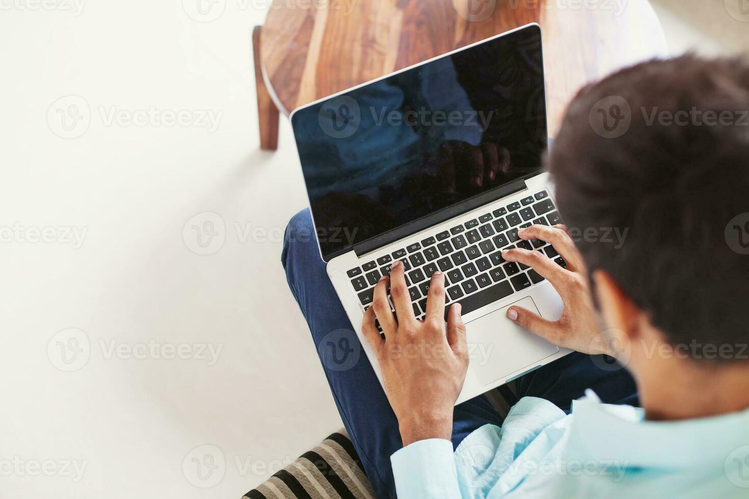 Mockup of laptop with empty screen held by a man wearing corporate formal clothes photo