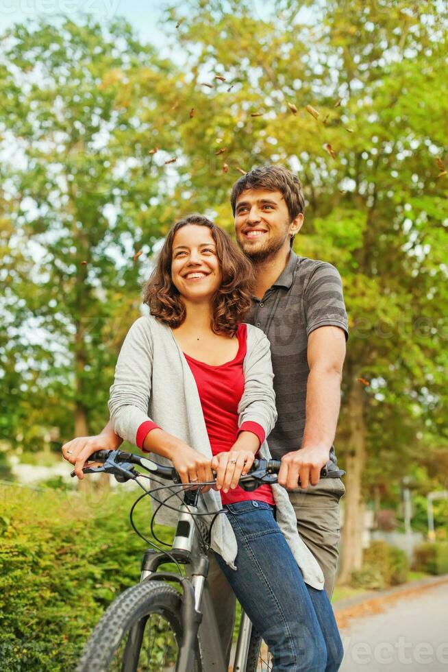 people in love - riding together on the same bicycle photo