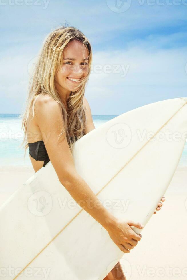 young woman at home with laptop photo