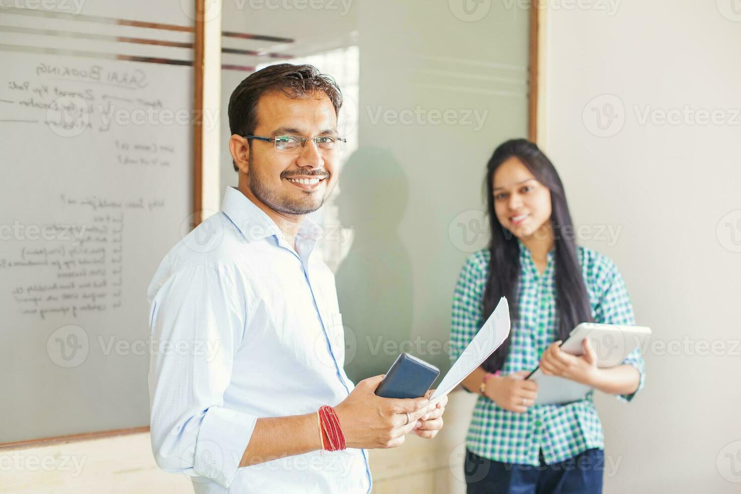 Indian business team of two people standing and looking at camera photo