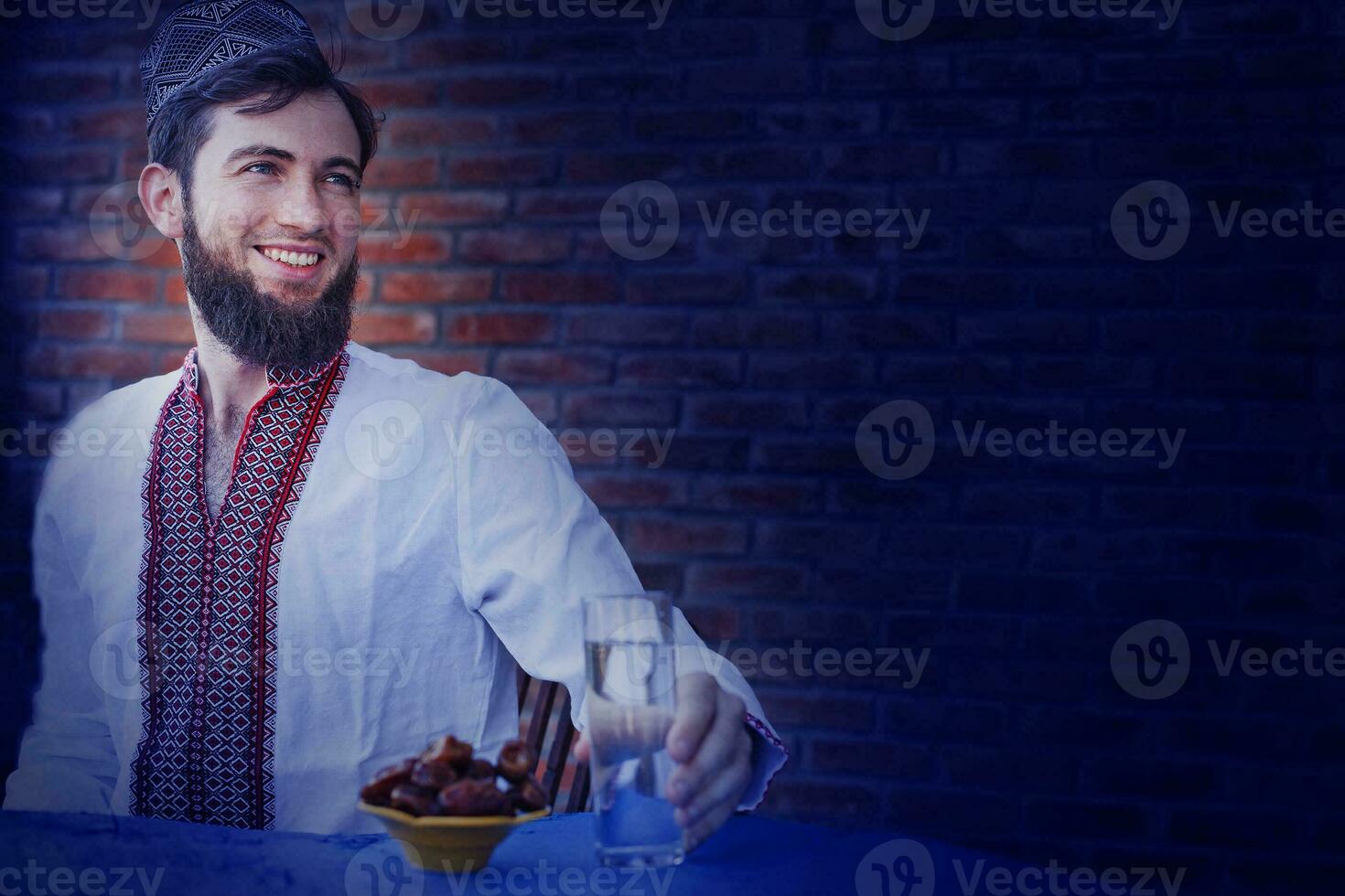 man waiting for sunset in ramadan photo