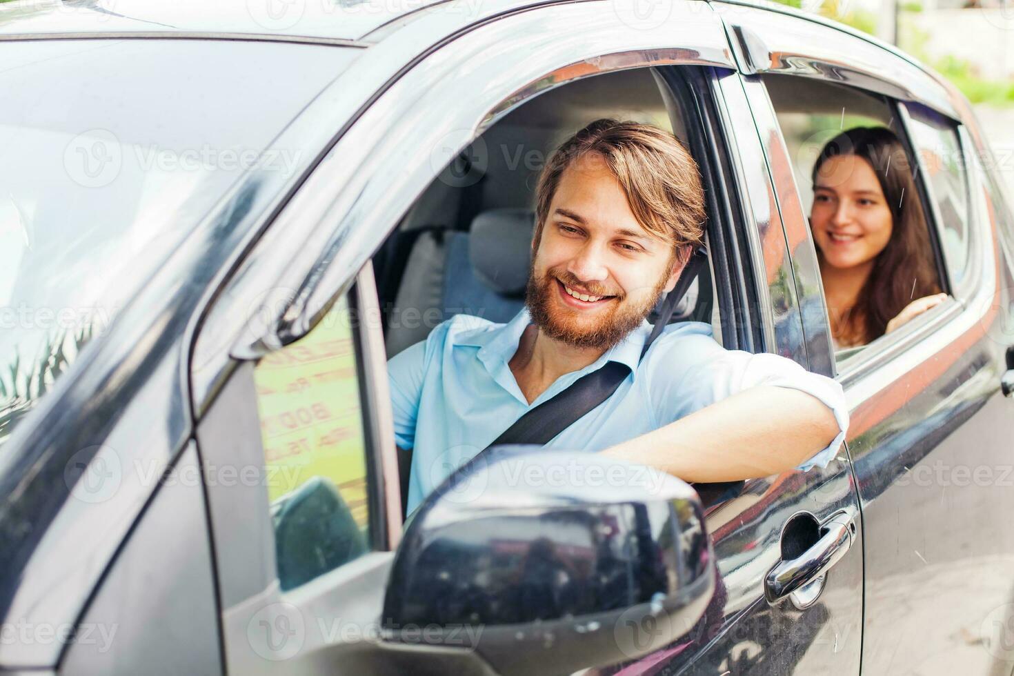 Happy family driving a car photo