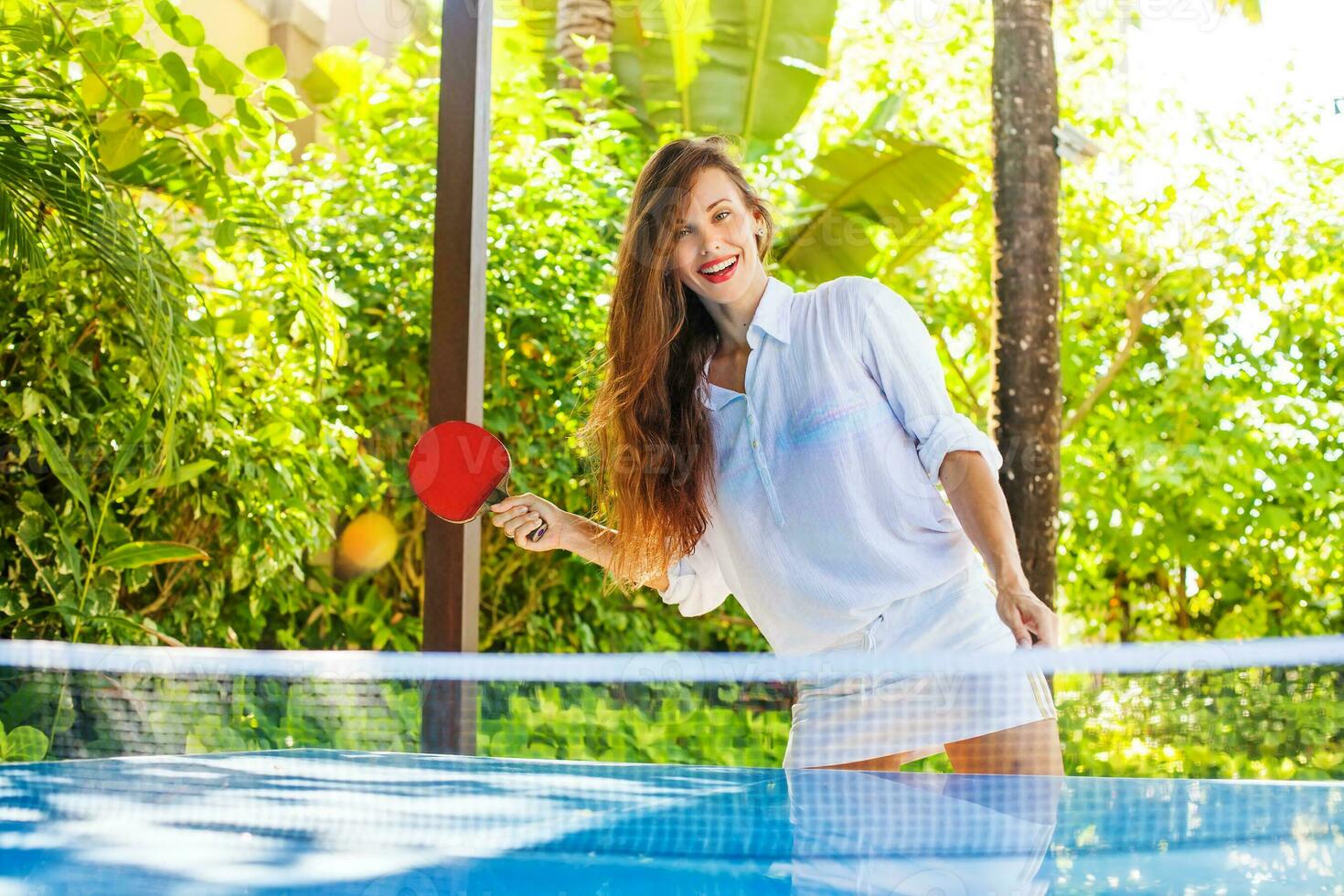 beautiful russian woman playing table tennis photo