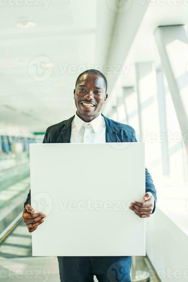 man holding blank board photo