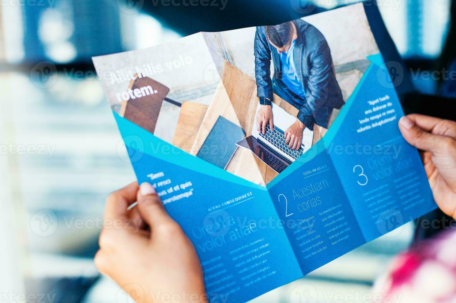 Hands holding a business brochures photo