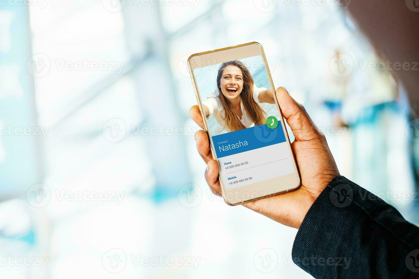 hand holding a phone. beautiful caucasian woman making incoming call photo