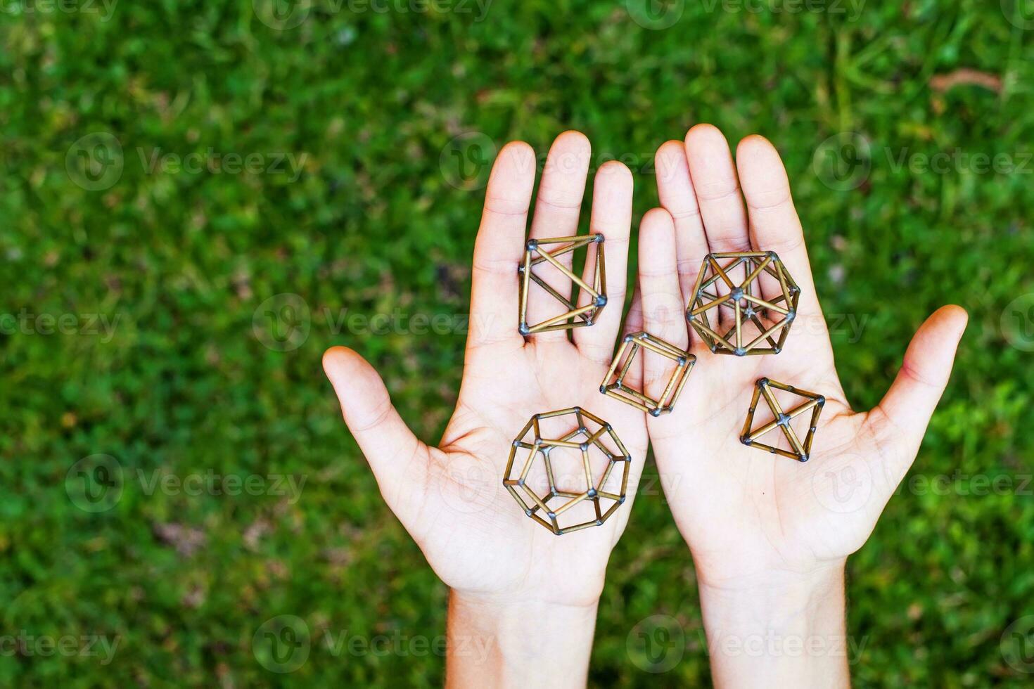 Hands holding sacred geometry photo