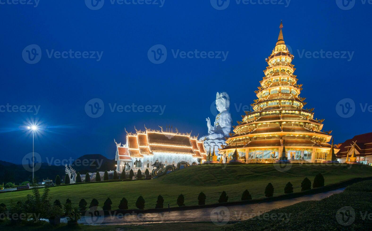 The Chinese pagoda style of Wat Huay Pla Kang in Chiang Rai province of Thailand at night. photo