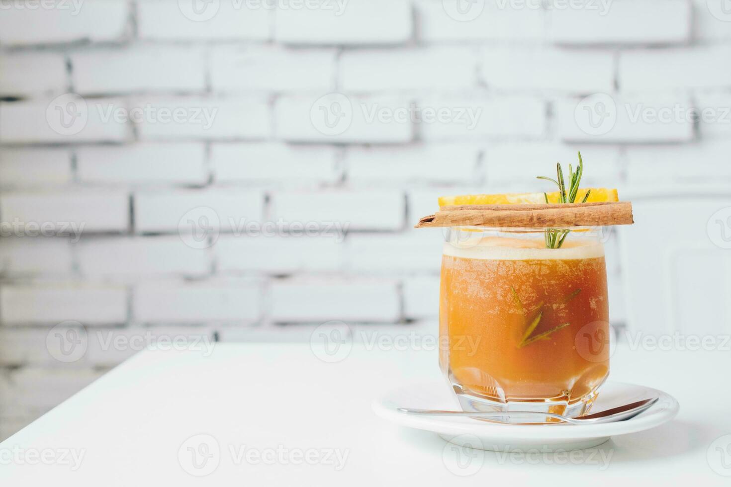 The passion fruit Mocktail serving on white table with isolated white background. photo