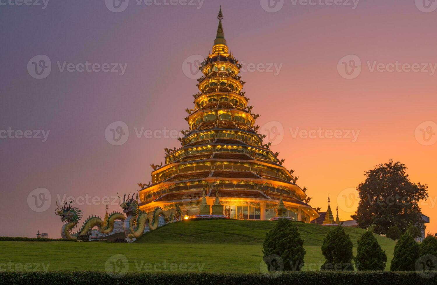 The Chinese pagoda style of Wat Huay Pla Kang in Chiang Rai province of Thailand at dusk. photo