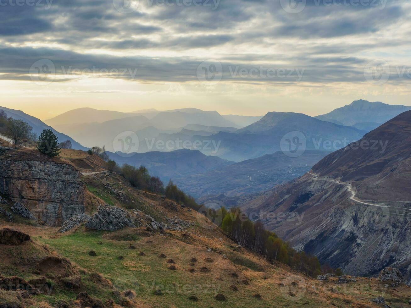 Bright last rays of the setting sun over a mountainous plateau. Matlas Valley at sunset in Dagestan. photo