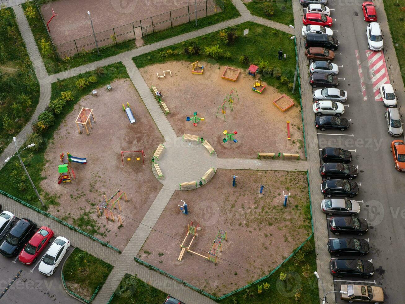Yard area, Parking in the yard, round a children's Playground. Aerial view. photo