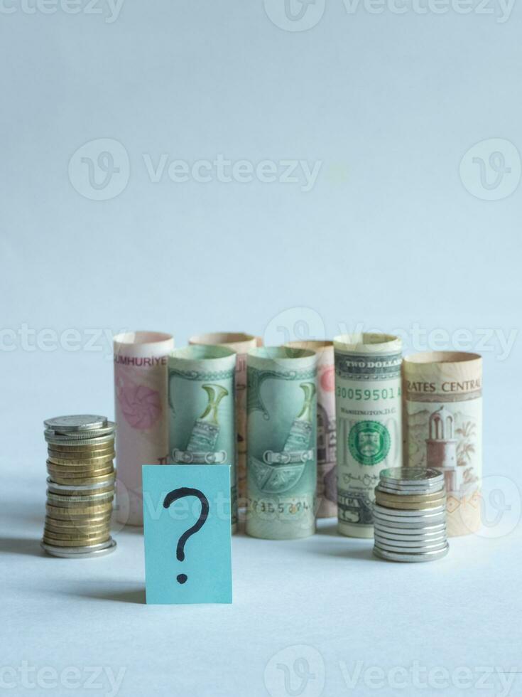 Question mark and money. Pandemic and the economic crisis of the concept photo