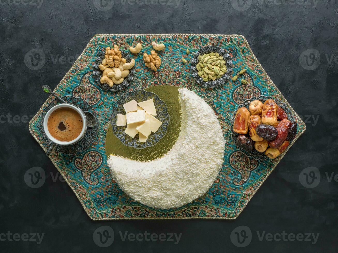Festive food Ramadan background. Delicious homemade cake in the shape of a Crescent moon, served with dates and coffee cup photo